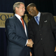 Then-President George W. Bush and Kirbyjon Caldwell shake hands at the Power Center in Southwest Houston on Sept. 12, 2003.